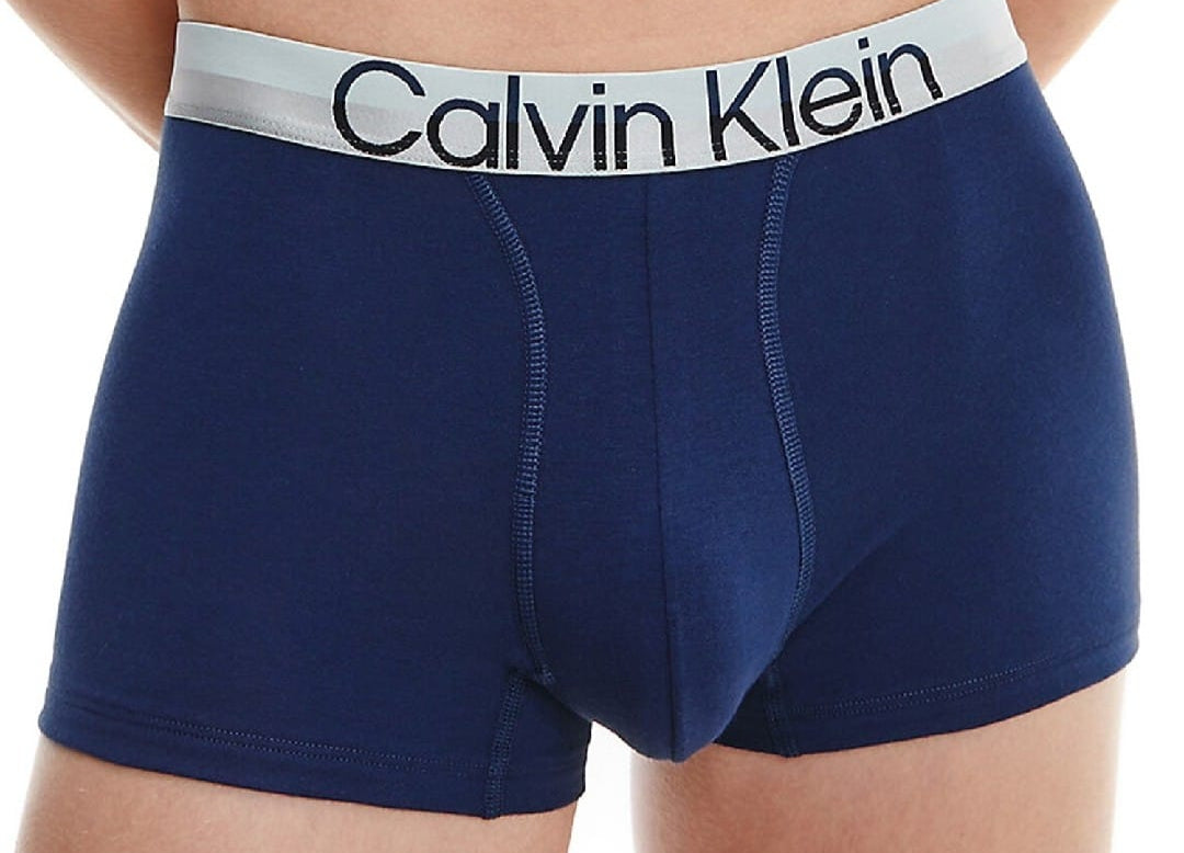 Navy blue boxer briefs with Calvin Klein logo on a white background